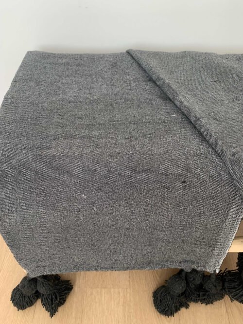 Plaid à pompons gris uni