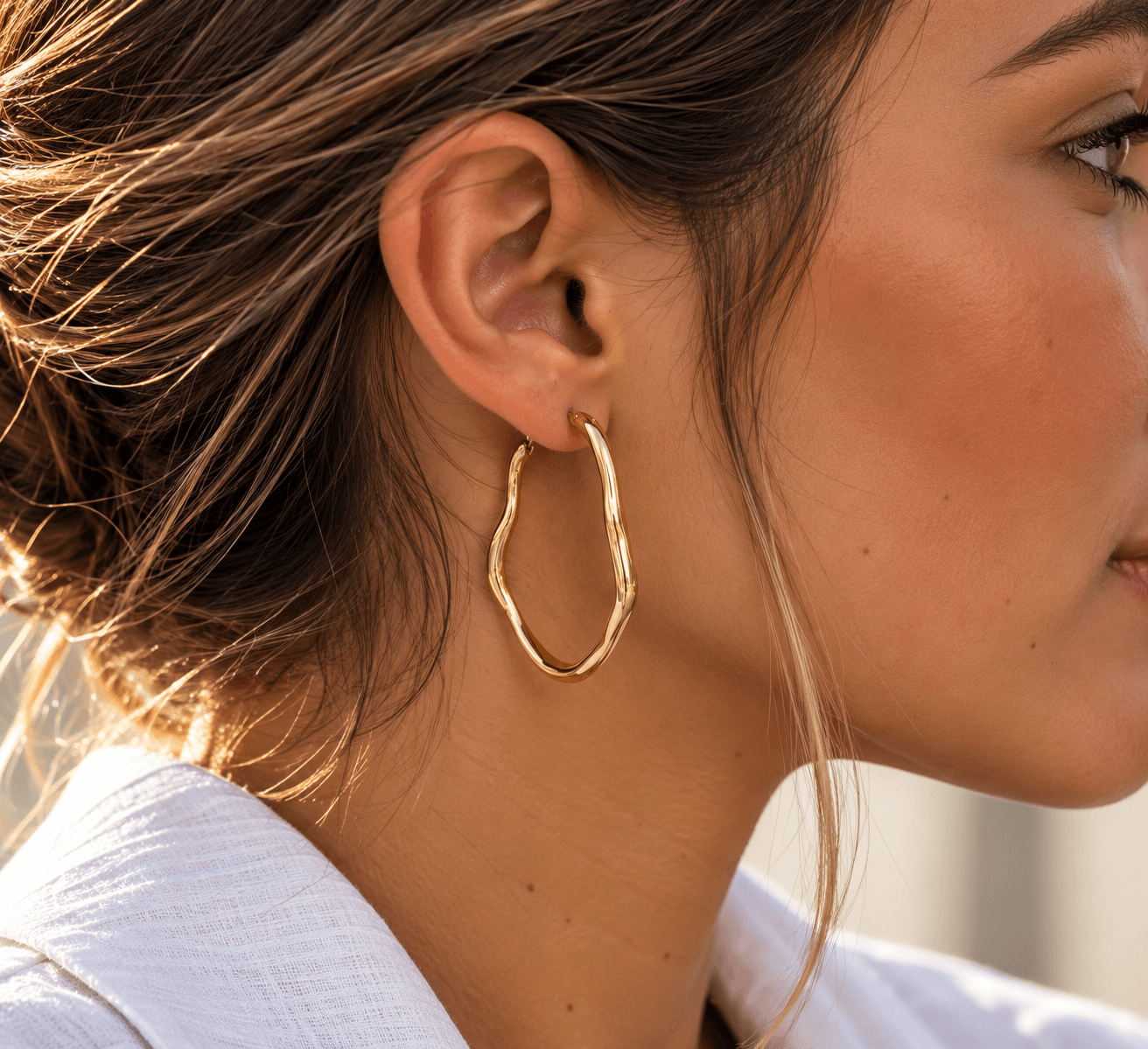 Boucles d’oreilles créoles irrégulières